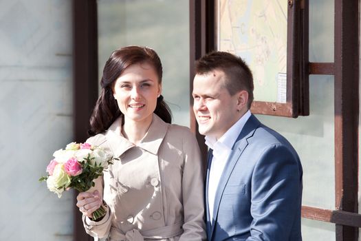 beautiful bride and groom with bouquet