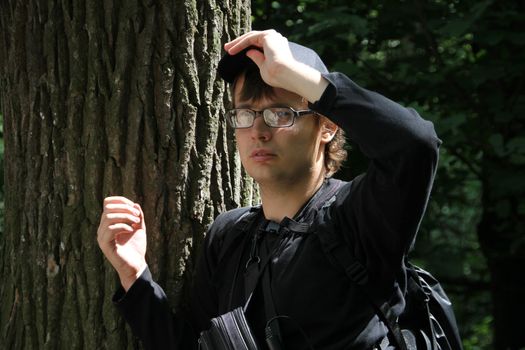 Khimki, Moscow region, Russia - July 21, 2012. Journalist cameraman Dmitry Zykov during a meeting of residents of the city Khimki. The gathering of the Khimki forest defenders and residents in the grove near the source of St. George. The meeting devoted to the threat of cutting down oak