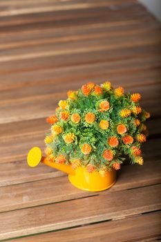 Vase flower pot. Placed on a table made of wood inside the house.