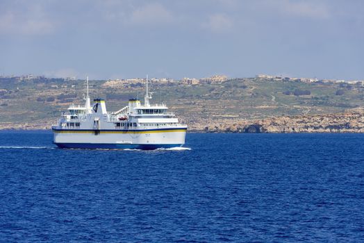 Malta ferry boat with Gozo island on background