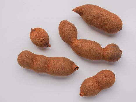 Raw tamarind fruits (tamar hindi - Tamarindus indica)