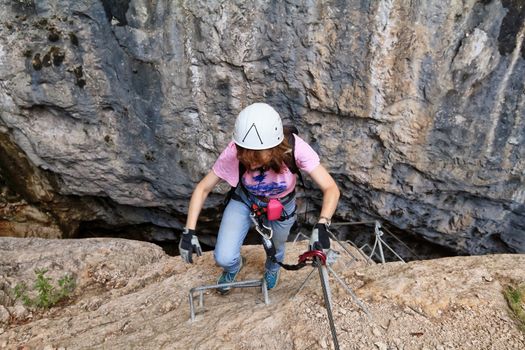 climber on Burrone Giovannelli via ferrata, Mezzacorona, Trentino, Italy