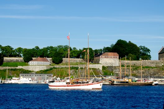 Boat with Akershus Fortress on background, Oslo, Norway