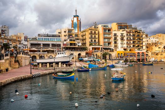 MALTA - JANUARY 23: Spinola Bay and Portomaso Tower in Saint Julian, Malta on January 23, 2015. Portomaso Business Tower is the tallest building in Malta. Opened in 2001, the Tower is 98 metres (322 ft) tall, with 23 floors of mixed commercial office space.