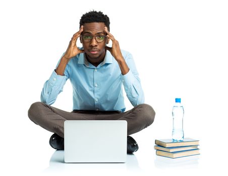 African american college student sitting with laptop on white background