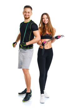 Happy sport couple - man and woman with with ropes on the white background