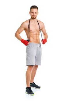 Athletic attractive manwith a rope on the white background