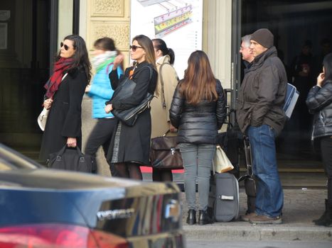 BOLOGNA, ITALY - circa november 2014: people queueing in front of the main train station