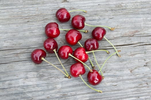 Sweet cherries on the old wooden table