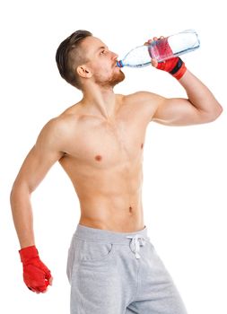 Sport attractive man wearing boxing bandages with bottle of water on the white background