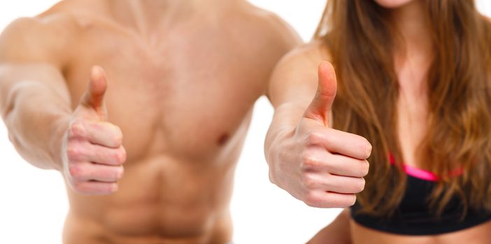 Sport man and woman after fitness exercise with a finger up on the white background
