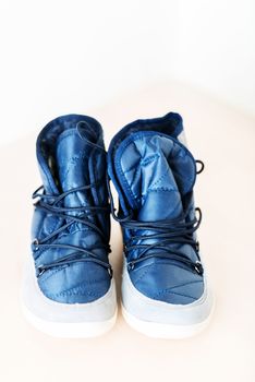 Pair of dark blue female boots with shoe string