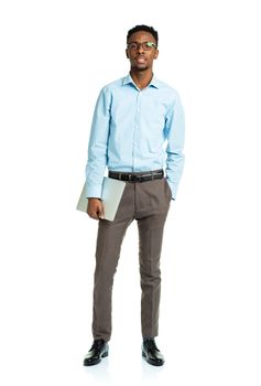 Happy african american college student standing with laptop on white background