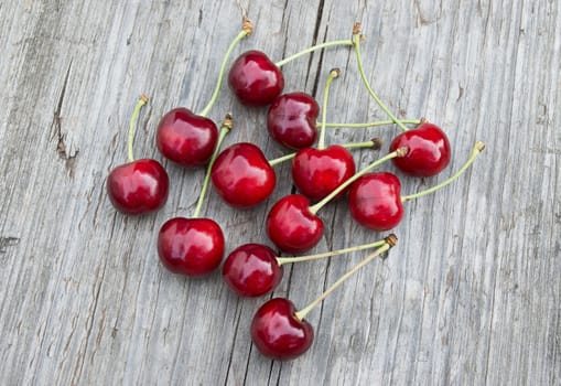 Sweet cherries on the old wooden table