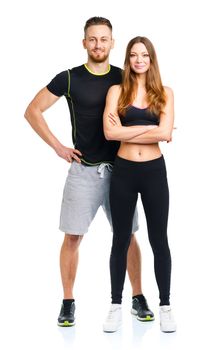 Sport couple - man and woman after fitness exercise on the white background