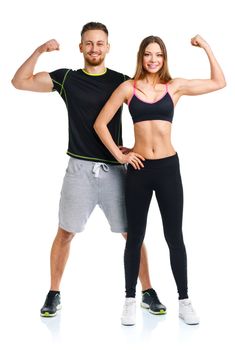 Sport couple - man and woman after fitness exercise on the white background