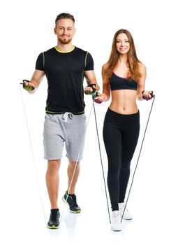 Happy sport couple - man and woman with with ropes on the white background