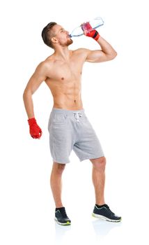 Sport attractive man wearing boxing bandages with bottle of water on the white background