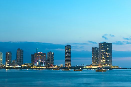 IQUIQUE, CHILE - JANUARY 22, 2015: The peninsula at the end of Cavancha beach with hotels  and modern apartment buildings photographed in the evening on January 22, 2015 in Iquique, Chile 