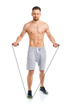 Athletic attractive manwith a rope on the white background