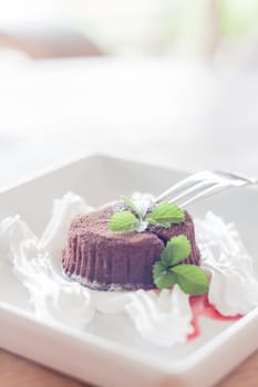 Chocolate lava with fork for serving, stock photo