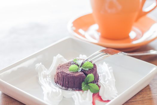 Chocolate lava with orange coffee cup, stock photo