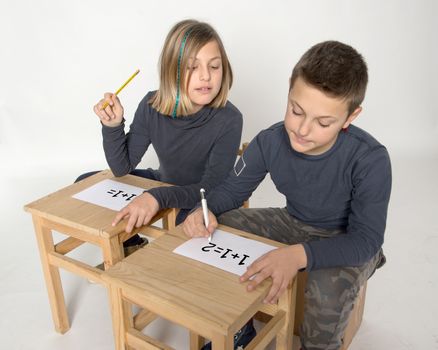 Children intent on solving a problem of calculation