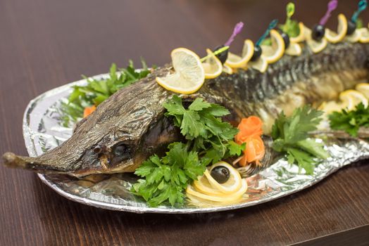 sturgeon baked with greens fruits and vegetables