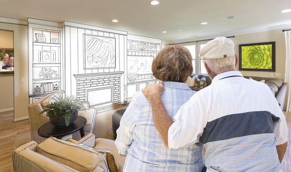 Senior Couple Looking Over Custom Living Room Design Drawing and Photo Combination.