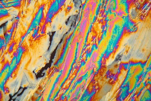 Holmium is a rare earth element and used for different applications in electronics, laser and glass coloring. The photo is made with a polarization microscope.