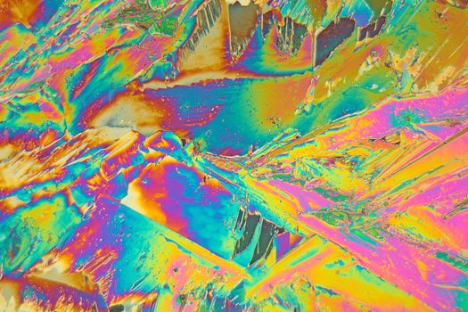 Holmium is a rare earth element and used for different applications in electronics, laser and glass coloring. The photo is made with a polarization microscope.