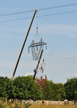 Top Changing of an Electrical Pylon with a Blue Sky