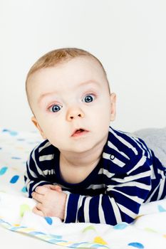 Adorable baby with blue eyes. studio photo