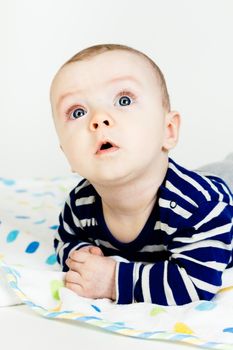 Adorable baby with blue eyes. studio photo