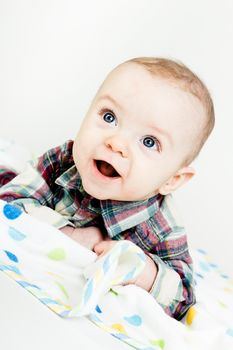 Adorable happy baby with blue eyes. studio photo