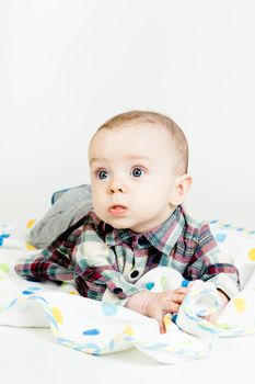 Adorable funny baby with blue eyes. studio photo