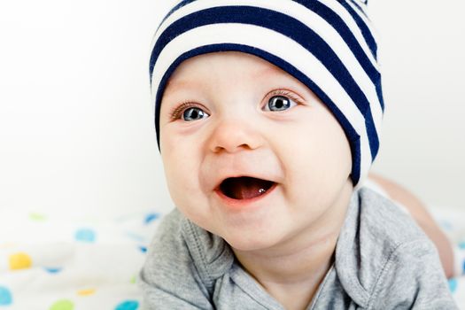 Adorable happy baby with blue eyes. studio photo