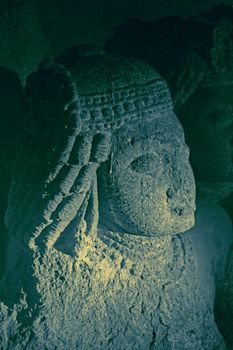 Sculpture at Aurangabad Cave 3, Aurangabad, Maharashtra, India. The Aurangabad caves are 12 artificial rock-cut Buddhist shrines located on a hill running roughly east to west, nearly 2 km north from Bibi Ka Maqbara in Aurangabad, Maharashtra, India. The Aurangabad Caves were dug out of comparatively soft basalt rock during the 6th and 7th century. Caves are divided into three separate groups depending on their location.