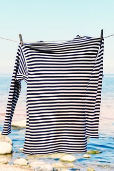 Striped shirt on the sea background