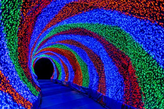 Colorful rainbow tunnel light, abstract background in night 