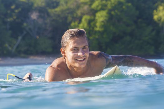 Surfer on Amazing Blue Wave, Bali island.