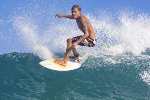 Surfer on Amazing Blue Wave, Bali island.