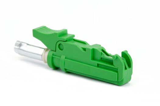green fiber optic E2000 connector on white background