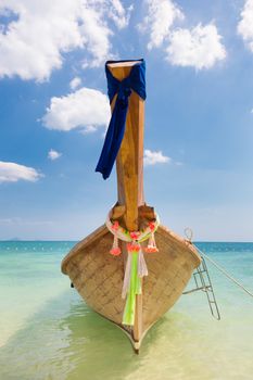 Traditional wooden boat in a picture perfect tropical Maya bay on Koh Phi Phi Leh Island, Thailand, Asia