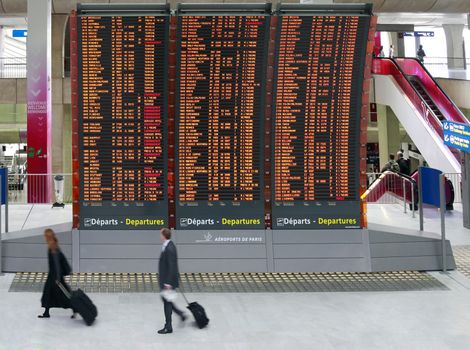 Paris, France - September 16, 2010: Flight announcement shows time of departure on a screen, airport Charles de Gaulle in Paris, France