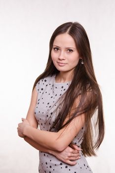Portrait of a beautiful young woman of the European type on a white background