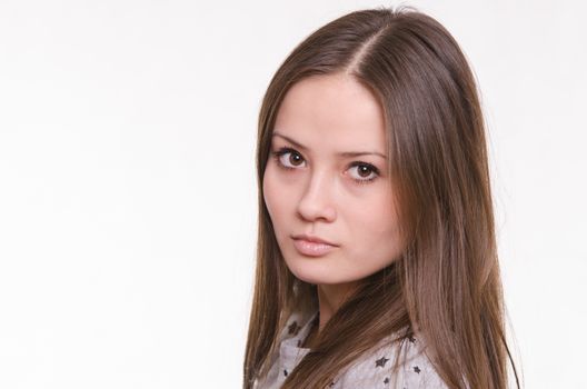 Portrait of a beautiful young woman of the European type on a white background