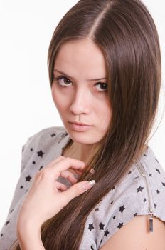 Portrait of a beautiful young woman of the European type on a white background