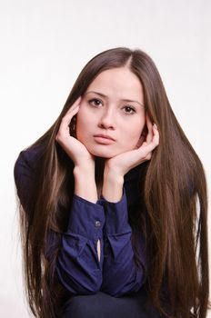 Portrait of a beautiful young woman of the European type on a white background