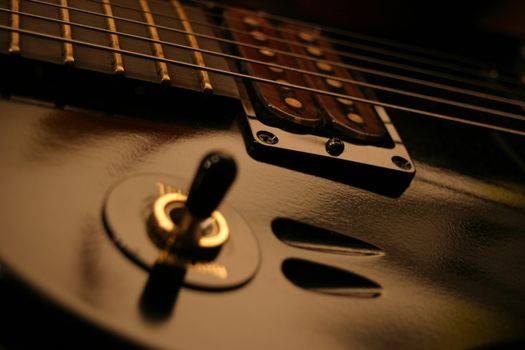A close up of a set of high outpup rock guitar pickups